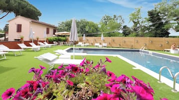 Seasonal outdoor pool, open 8 AM to 8:00 PM, pool umbrellas