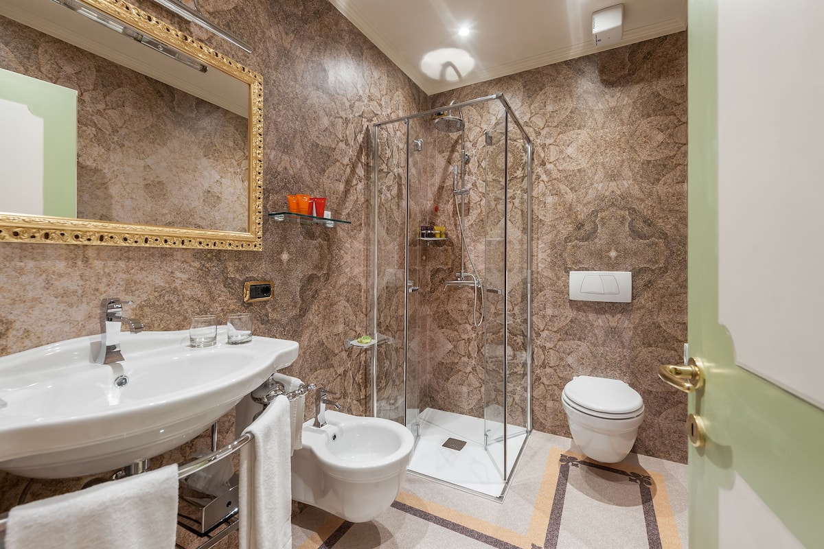 Shower, free toiletries, hair dryer, slippers