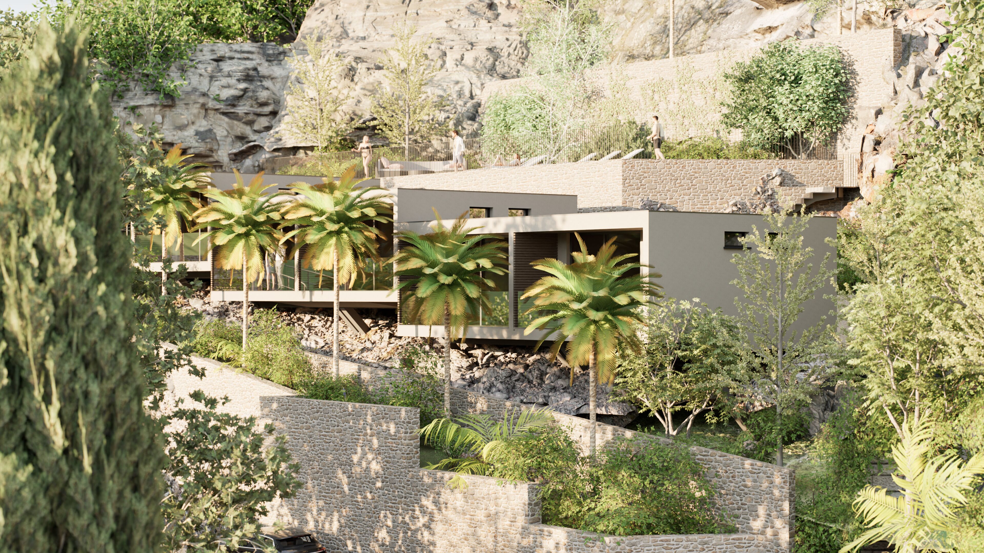 A modern building with a stone facade, surrounded by palm trees and greenery.