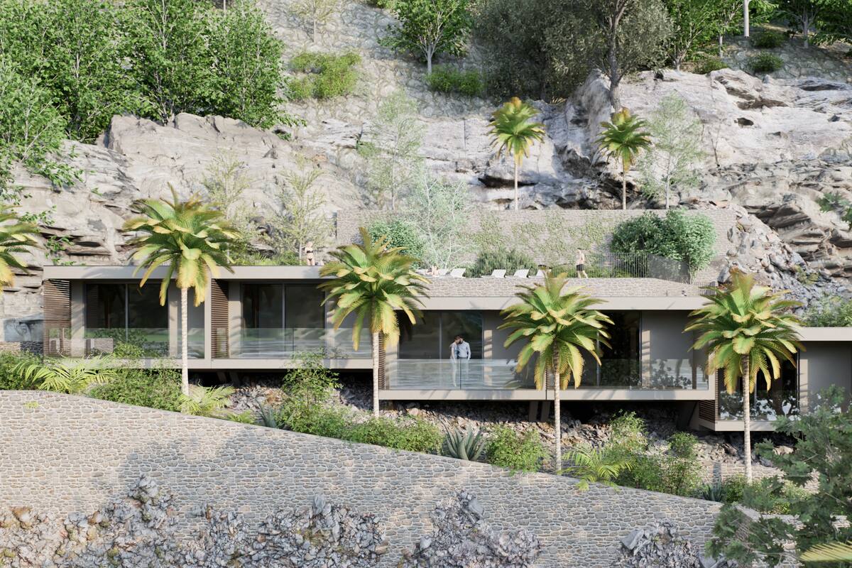 Eine moderne Villa mit Glasbalkon, umgeben von Palmen und felsigem Gelände.
