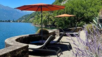 Private beach, white sand, sun loungers, beach umbrellas
