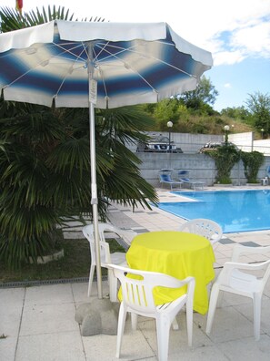 Seasonal outdoor pool, pool umbrellas, sun loungers