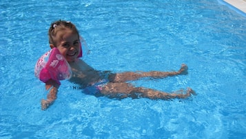 Seasonal outdoor pool, pool umbrellas, pool loungers