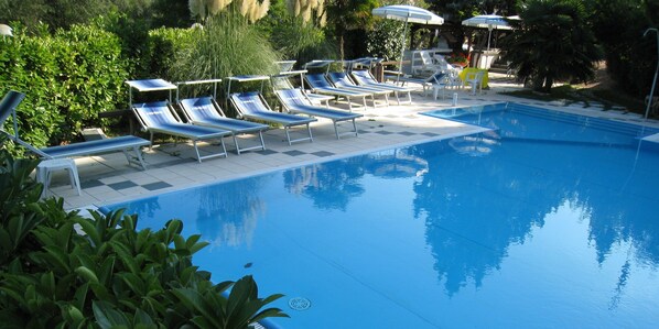 Seasonal outdoor pool, pool umbrellas, pool loungers