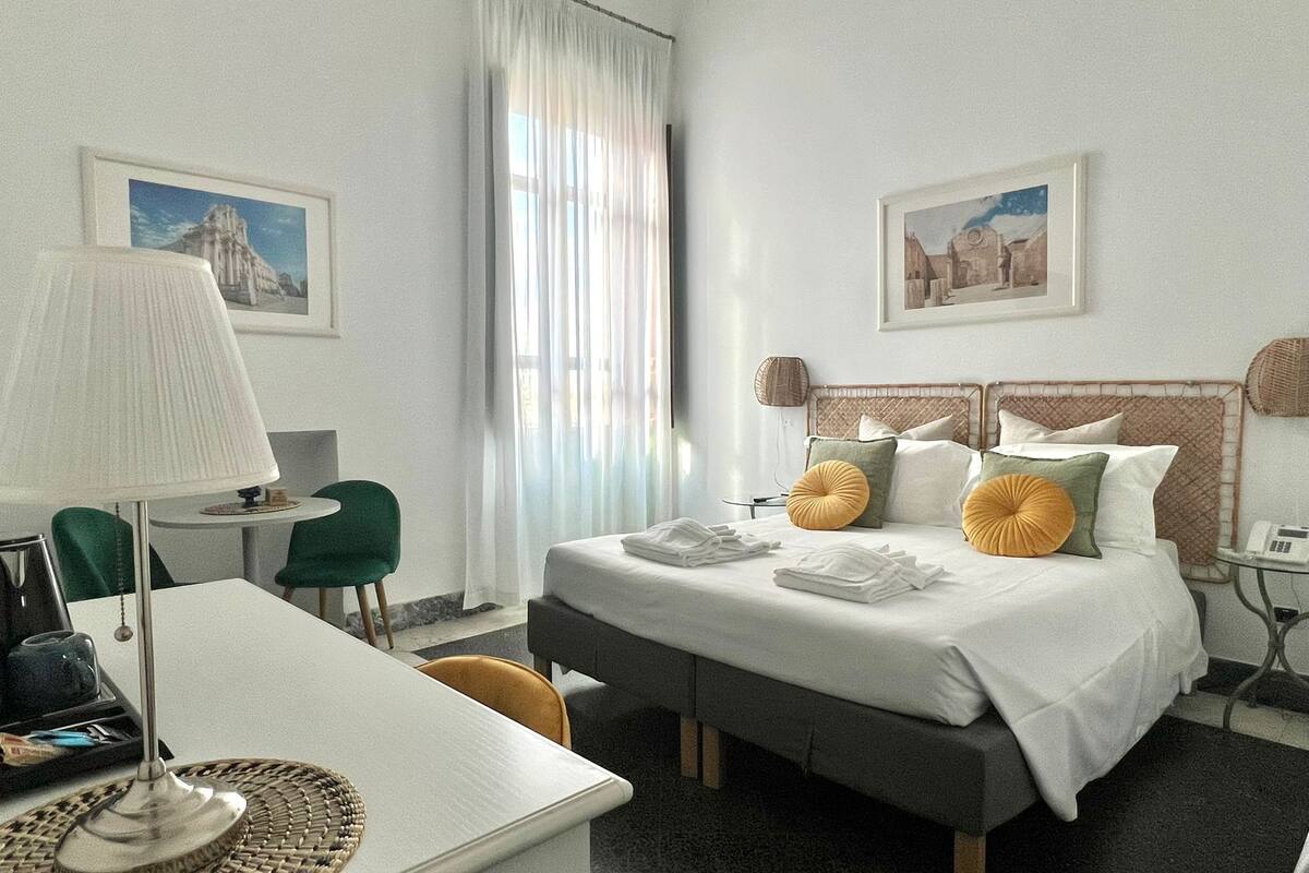 Triple Room, Multiple Beds, Sea View | Minibar, desk, free WiFi, bed sheets