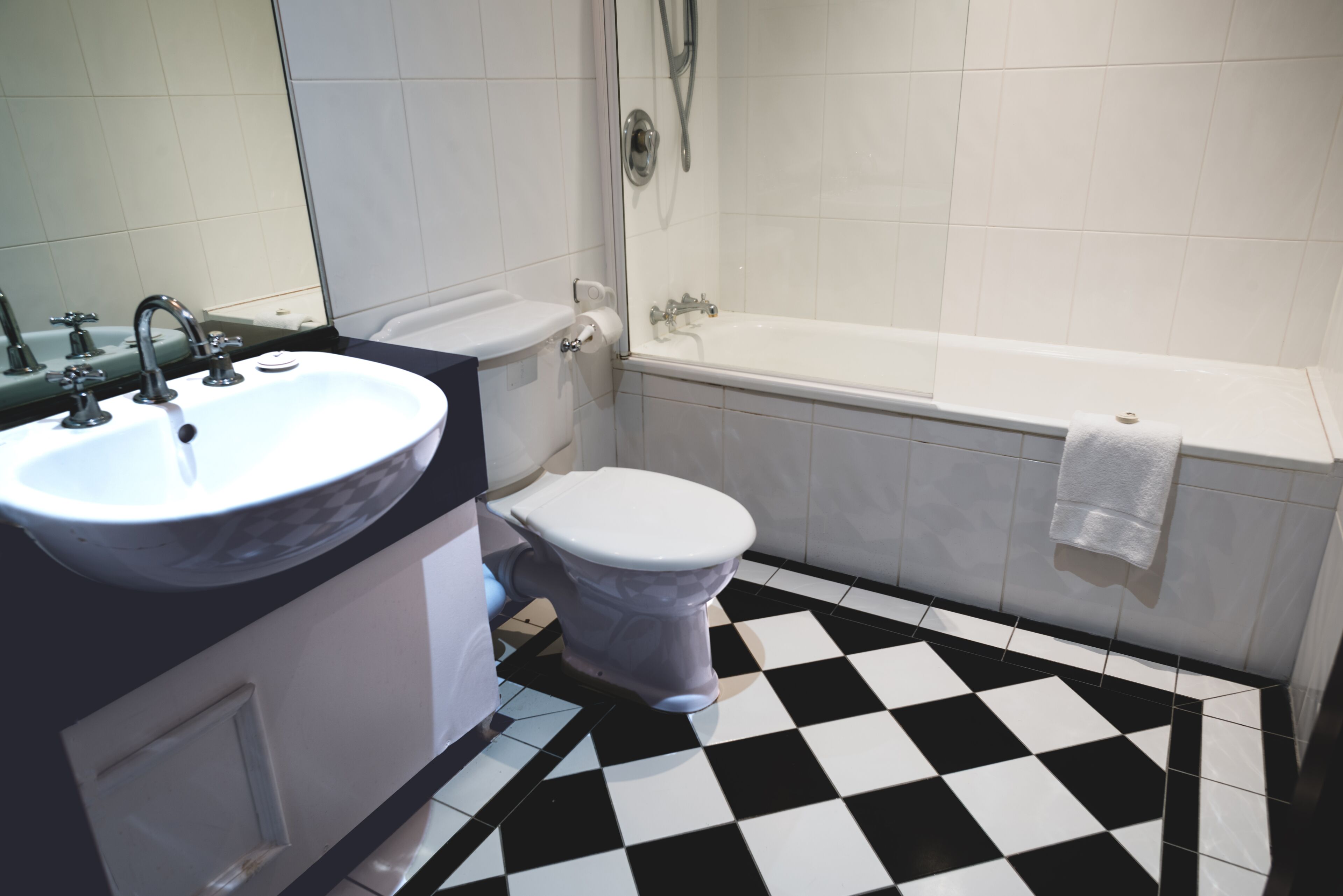 classic single room | bathroom | separate bathtub and shower, hair dryer, towels