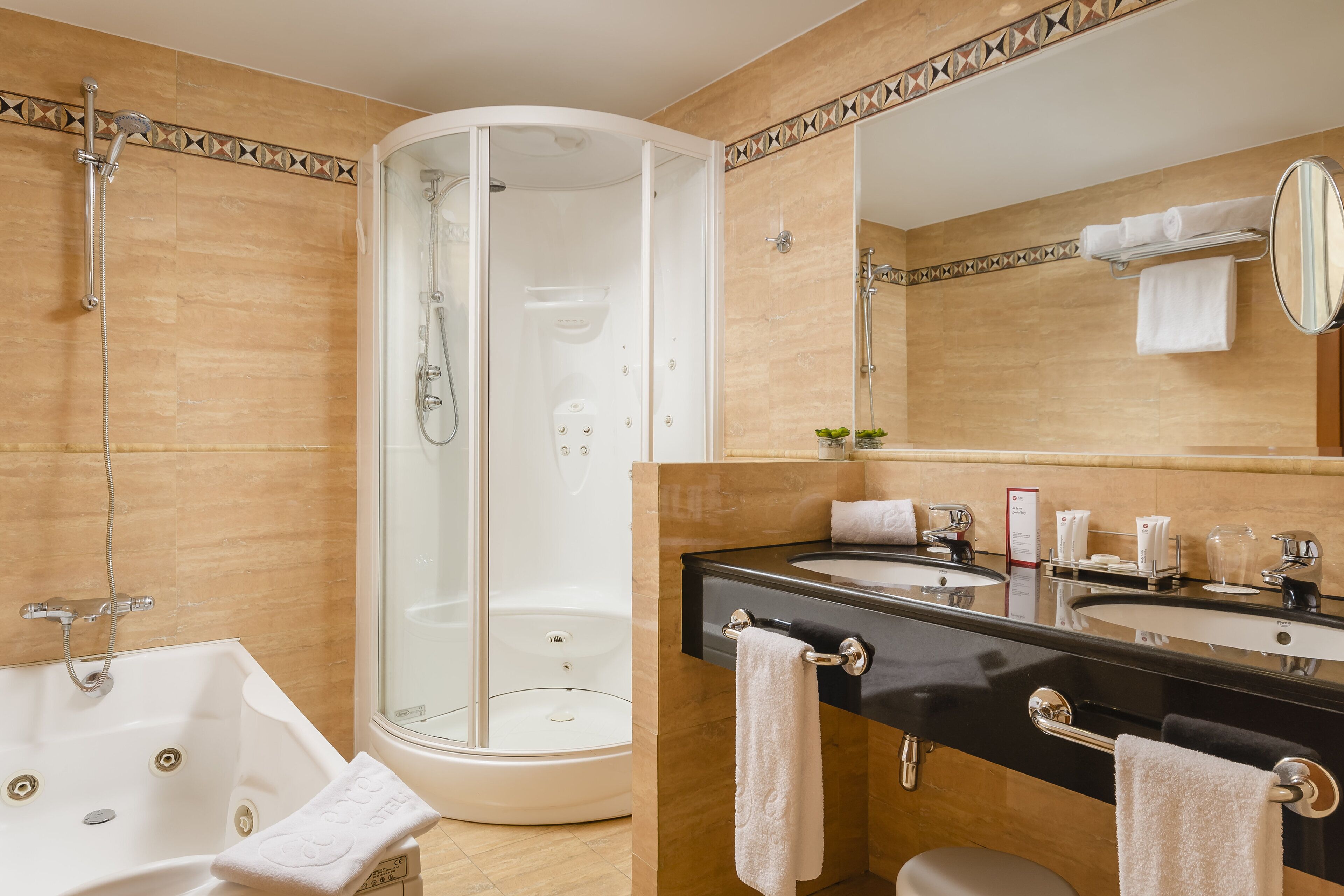 bathtub, eco-friendly toiletries, hair dryer, bathrobes