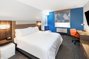 Relax in comfort with a large bed, desk, and flat-screen TV in this stylish room.