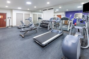 Stay fit and entertained in our well-equipped gym with treadmills, ellipticals, and dumbbells.