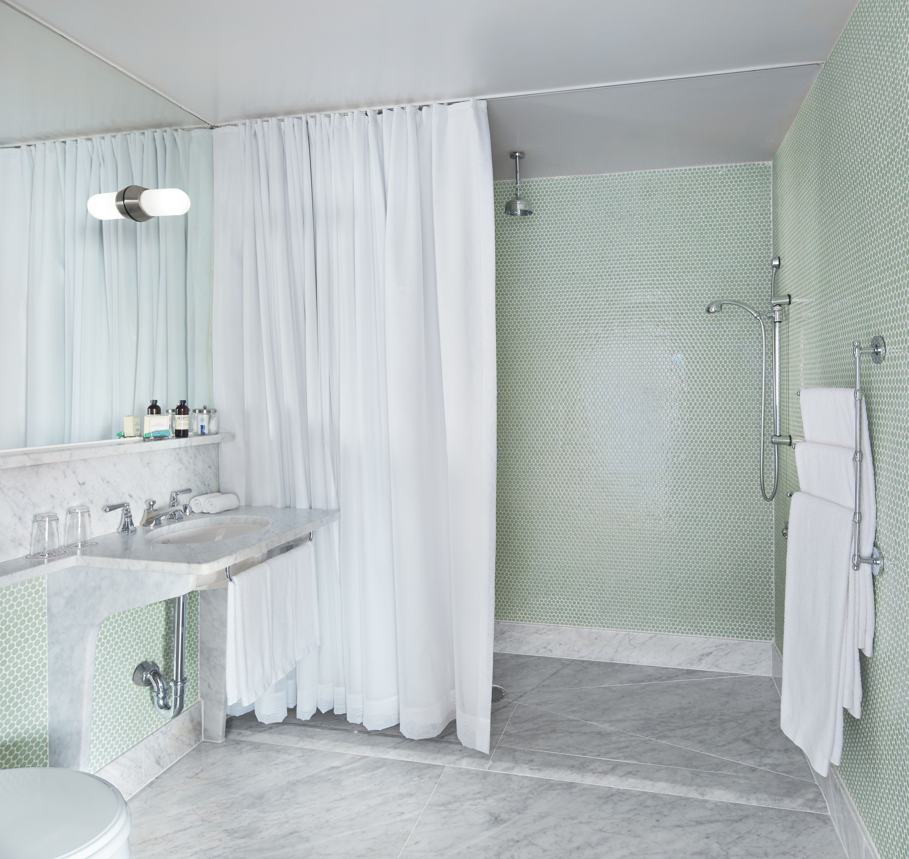 junior penthouse | bathroom | designer toiletries, hair dryer, towels