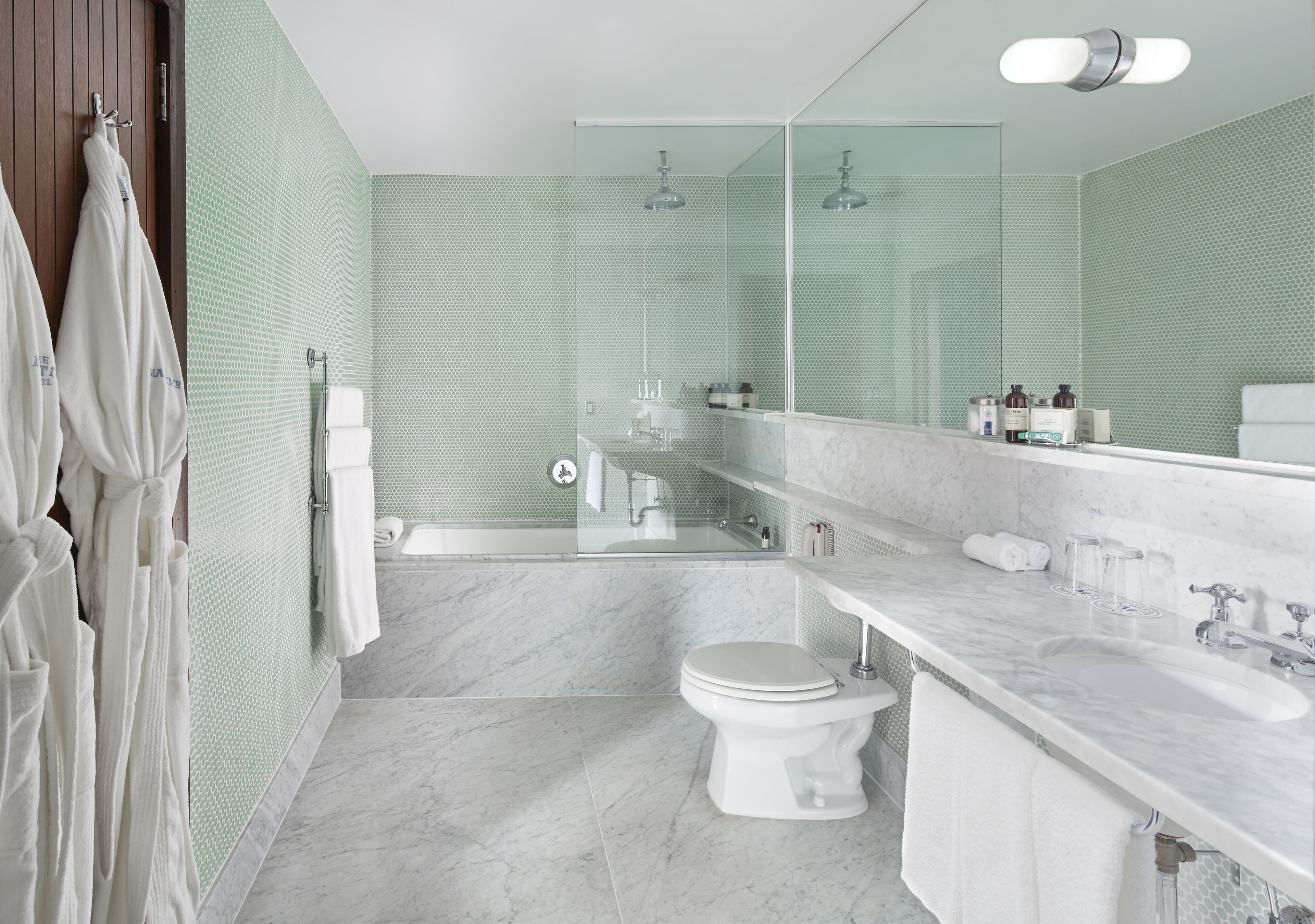 designer toiletries, hair dryer, towels