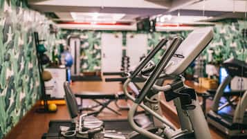 A gym with exercise equipment, including a treadmill and an elliptical machine.