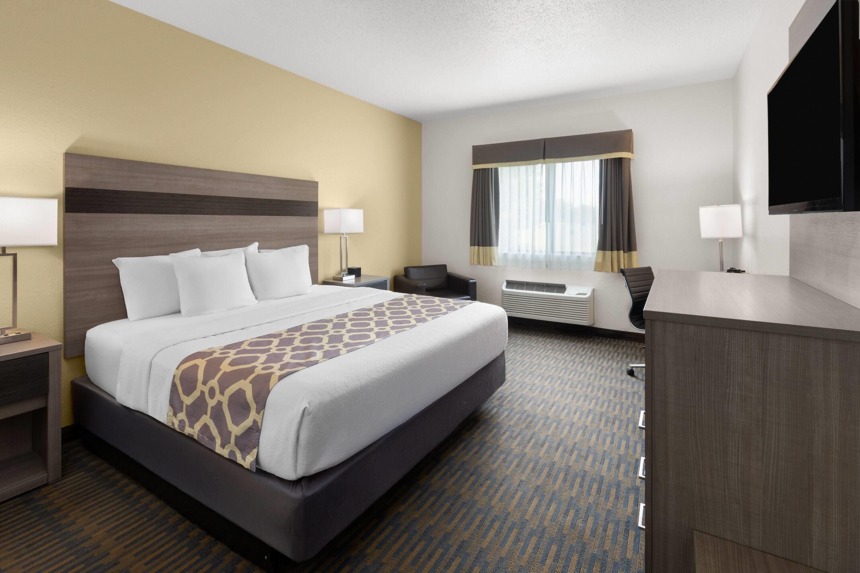 room, 1 king bed, non smoking | desk, iron/ironing board, free cots/infant beds, rollaway beds