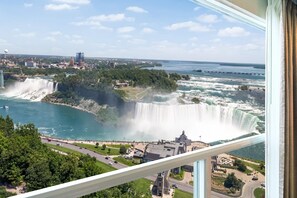 A view of Niagara Falls from a high vantage point, including a body of water, a waterfall, and surrounding buildings. - Hyatt Regency Niagara Falls Fallsview (Niagara Falls)