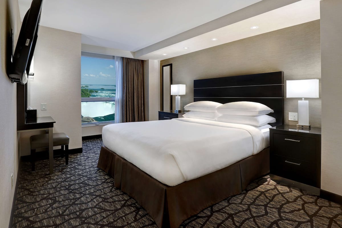 King Bed with Sofa Bed and partial view of Niagara Falls - Floors 10-25 | 1 bedroom, premium bedding, in-room safe, desk