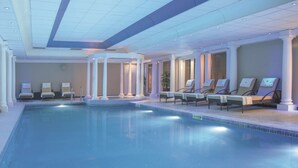 A large indoor swimming pool with lounge chairs and a ceiling with recessed lighting. - Macdonald Linden Hall Golf & Country Club (Morpeth)