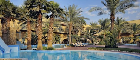 Outdoor pool, open 9:00 AM to 6:00 PM, pool loungers