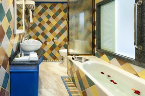 Designer toiletries, hair dryer, bathrobes, slippers