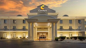 A Comfort Inn & Suites hotel entrance with a large sign, a covered walkway, and a well-lit facade. - Comfort Inn & Suites Carneys Point - Pennsville (Penns Grove)