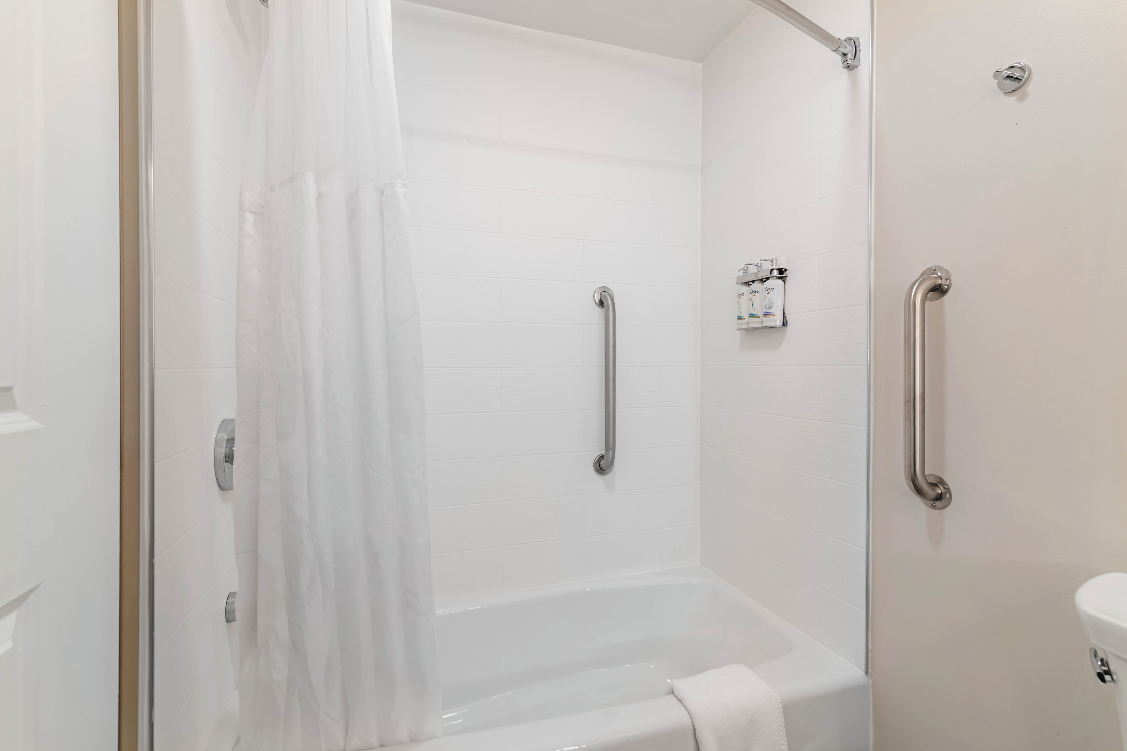 A bathroom with a bathtub, a shower, and a toilet.