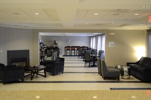 Relax and socialize in our inviting lobby, featuring a cozy fireplace and comfortable seating areas.