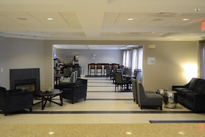 Relax and socialize in our inviting lobby, featuring a cozy fireplace and comfortable seating areas.