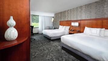 Premium bedding, desk, laptop workspace, blackout curtains