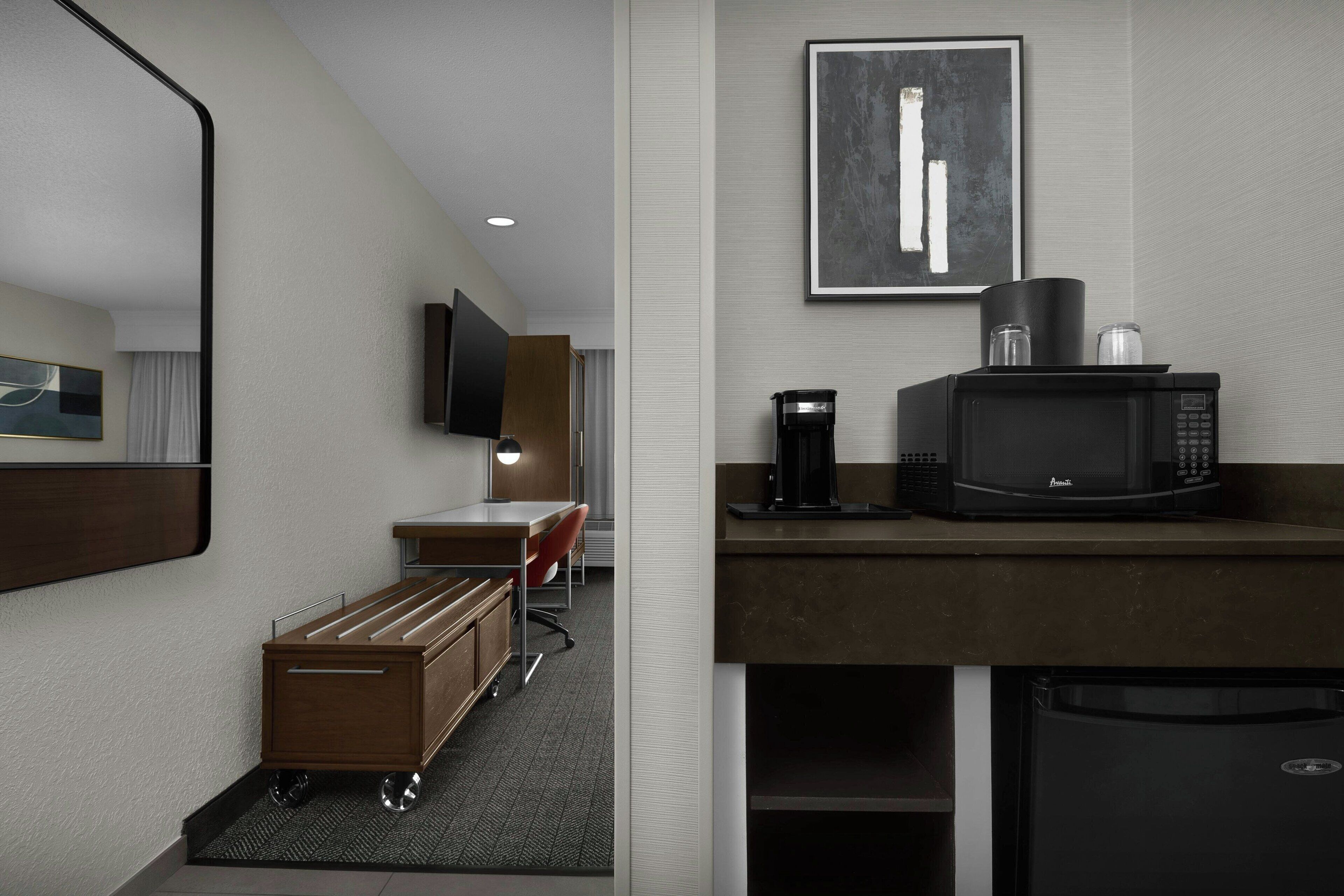 Premium bedding, desk, laptop workspace, blackout drapes