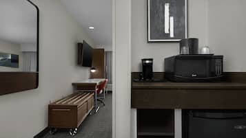 Premium bedding, desk, laptop workspace, blackout drapes