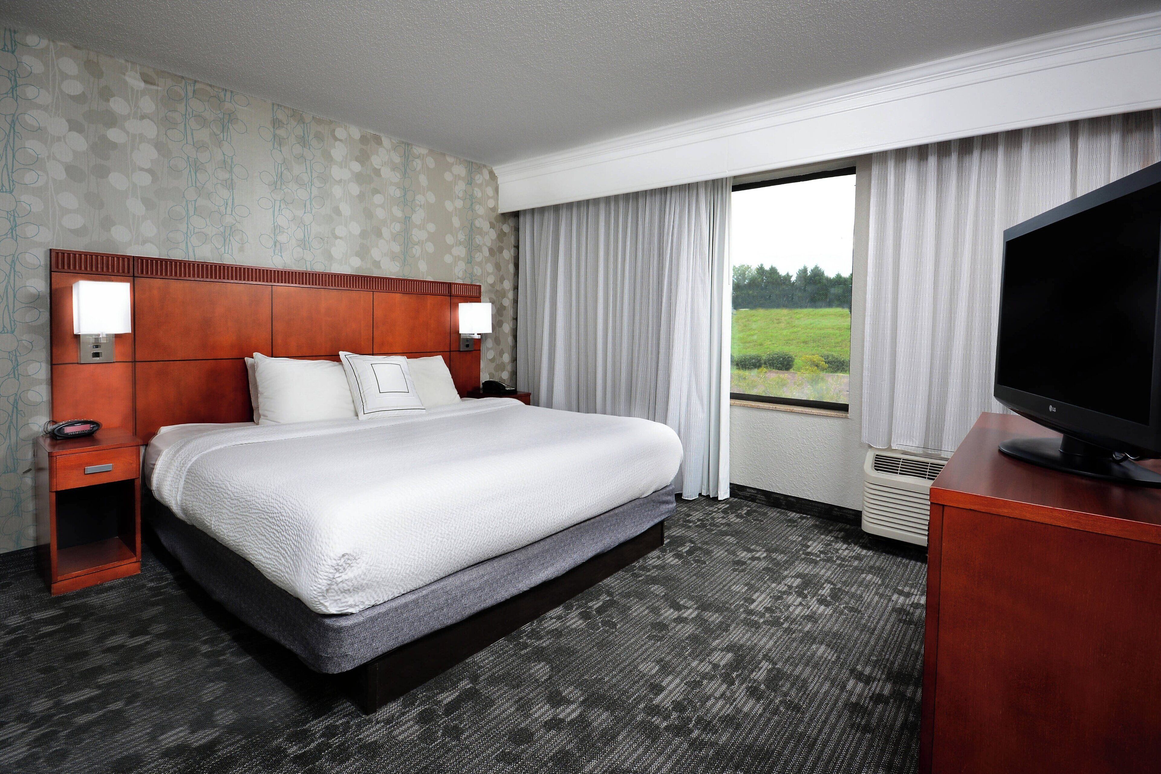 premium bedding, desk, laptop workspace, blackout curtains