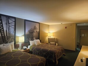 A hotel room with two beds, a nightstand, a lamp, and a framed picture of a bridge. - Super 8 by Wyndham Ava (Ava)