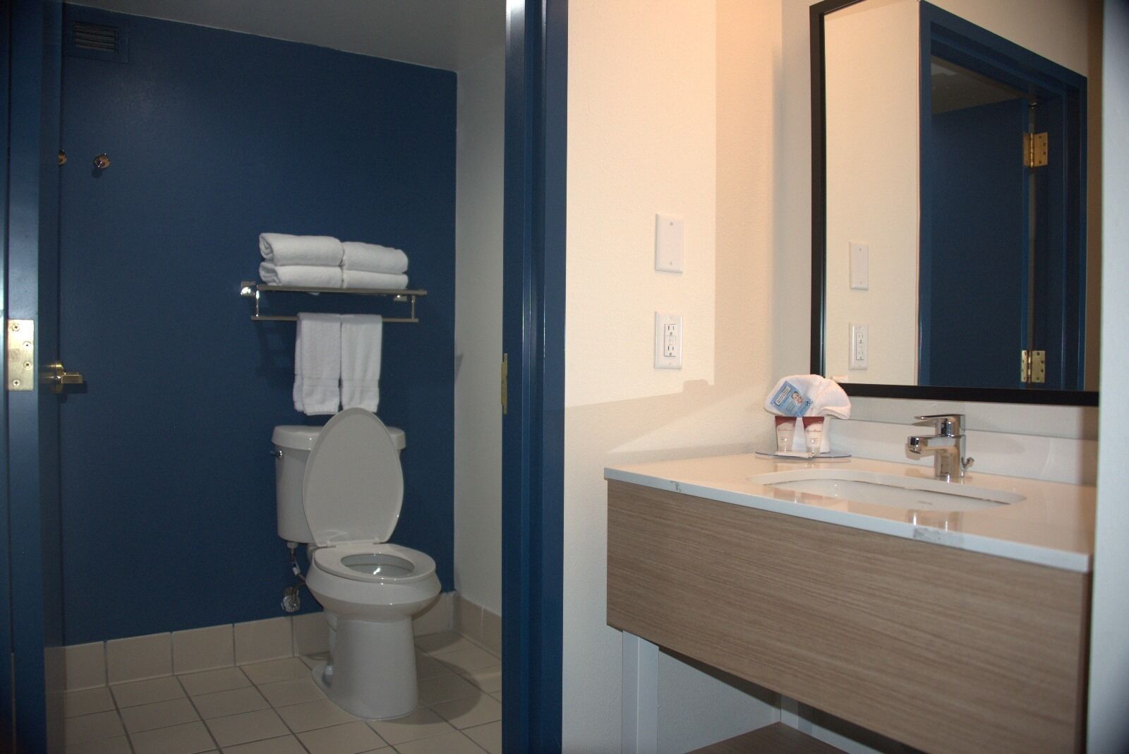 room, 2 queen beds | bathroom | free toiletries, hair dryer, towels