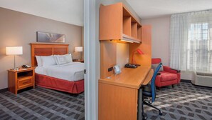 A hotel room with a bed, desk, chair, and a window with curtains. - TownePlace Suites by Marriott Knoxville Cedar Bluff (Knoxville)