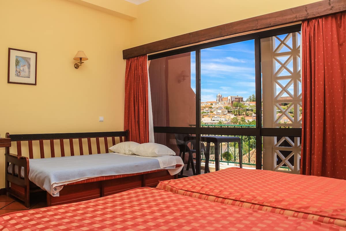 Triple Room (Castle view) | In-room safe, desk, travel cot, bed sheets