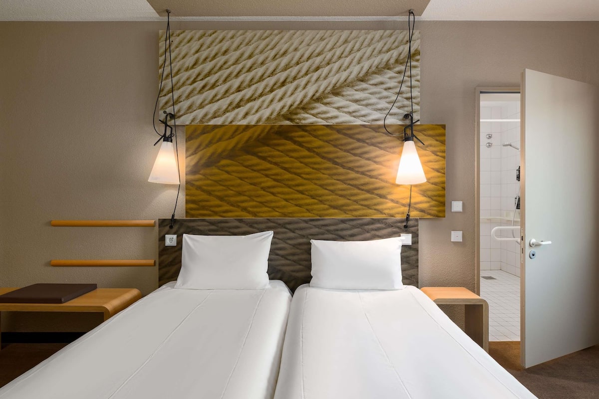 Hypo-allergenic bedding, pillow-top beds, in-room safe, desk