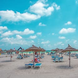 Private beach, white sand, sun loungers, beach umbrellas
