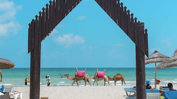 Private beach, white sand, sun loungers, beach umbrellas