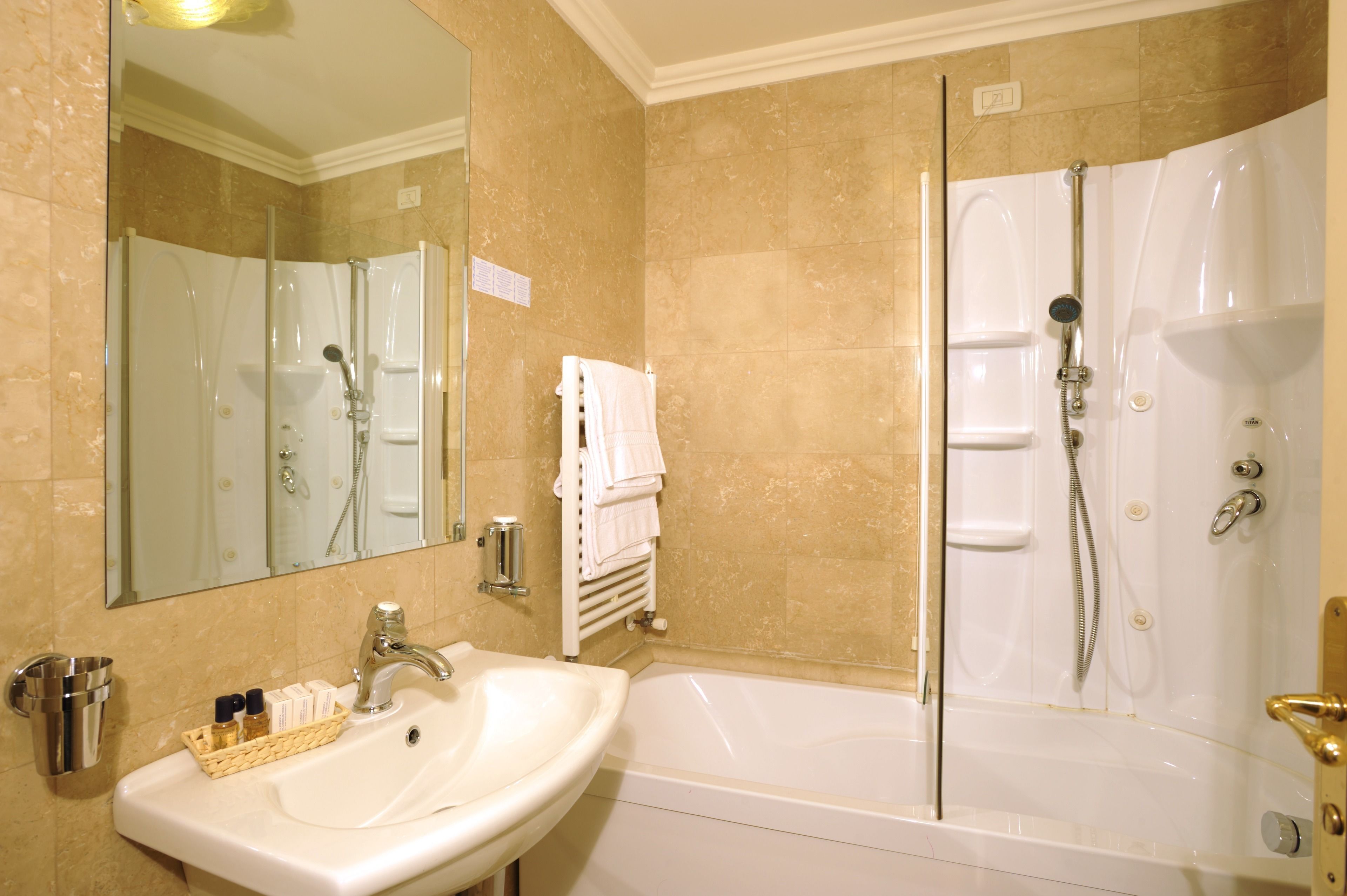 junior suite, lagoon view | bathroom | free toiletries, hair dryer, bidet, towels