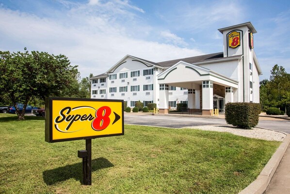A Super 8 hotel with a large sign in front, a parking lot, and a well-maintained lawn. - Super 8 by Wyndham Union (Union)