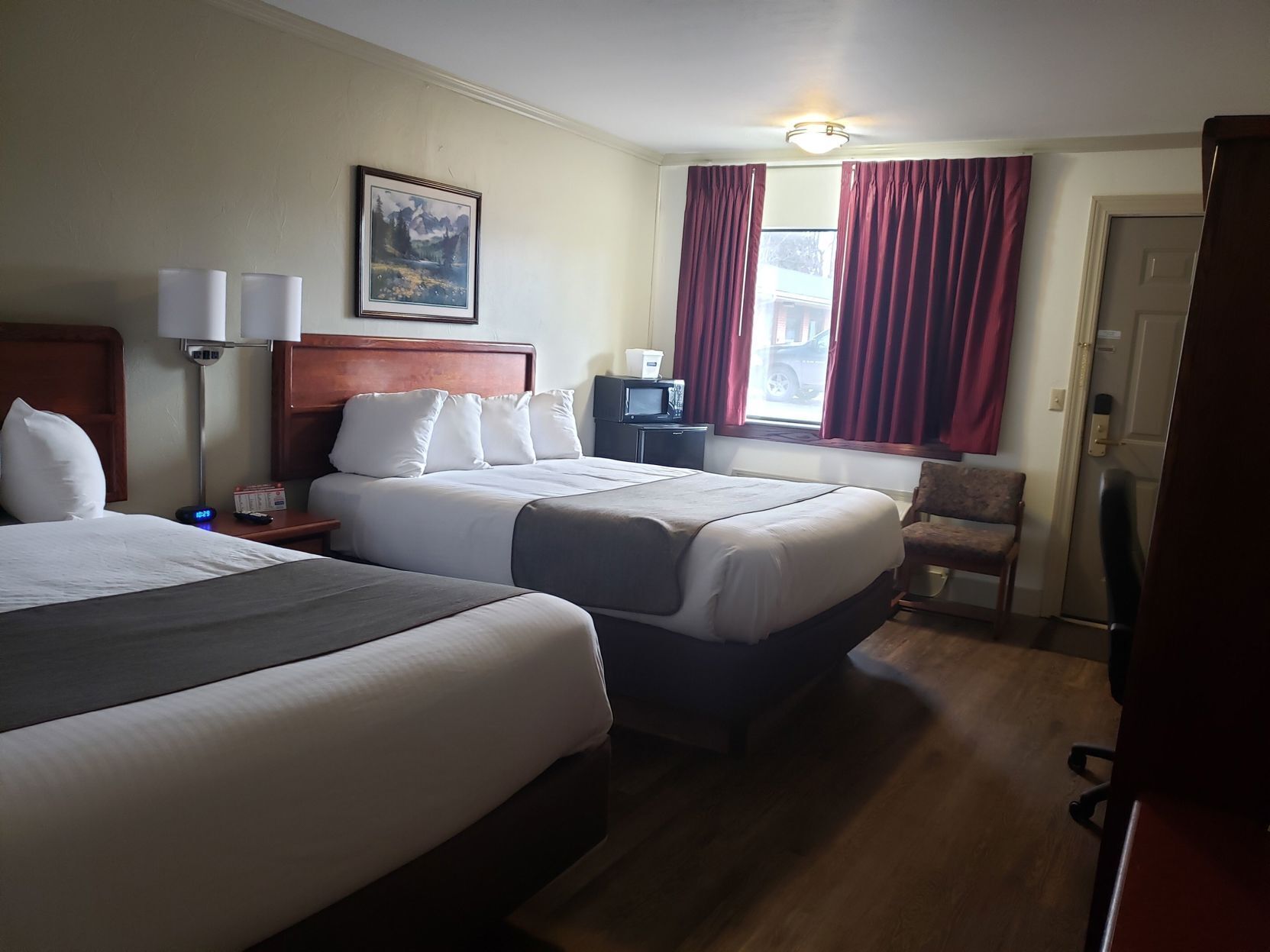Desk, blackout drapes, iron/ironing board, rollaway beds