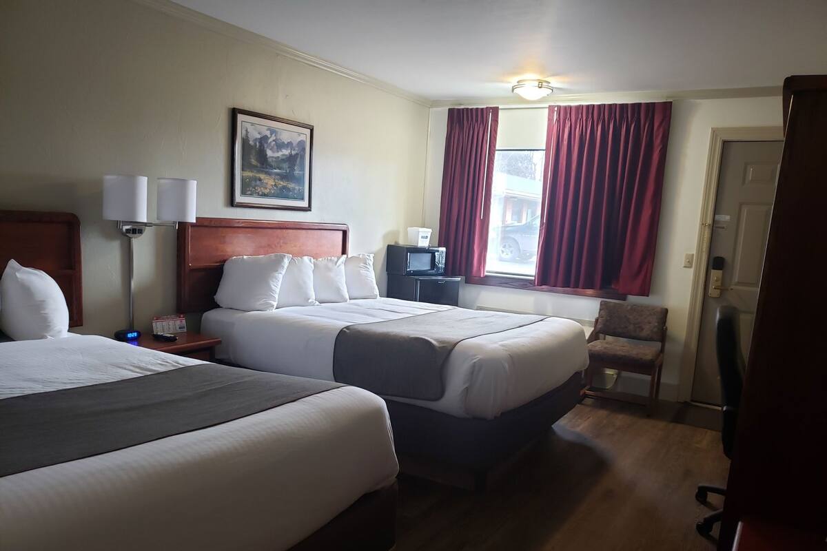 Desk, blackout drapes, iron/ironing board, rollaway beds