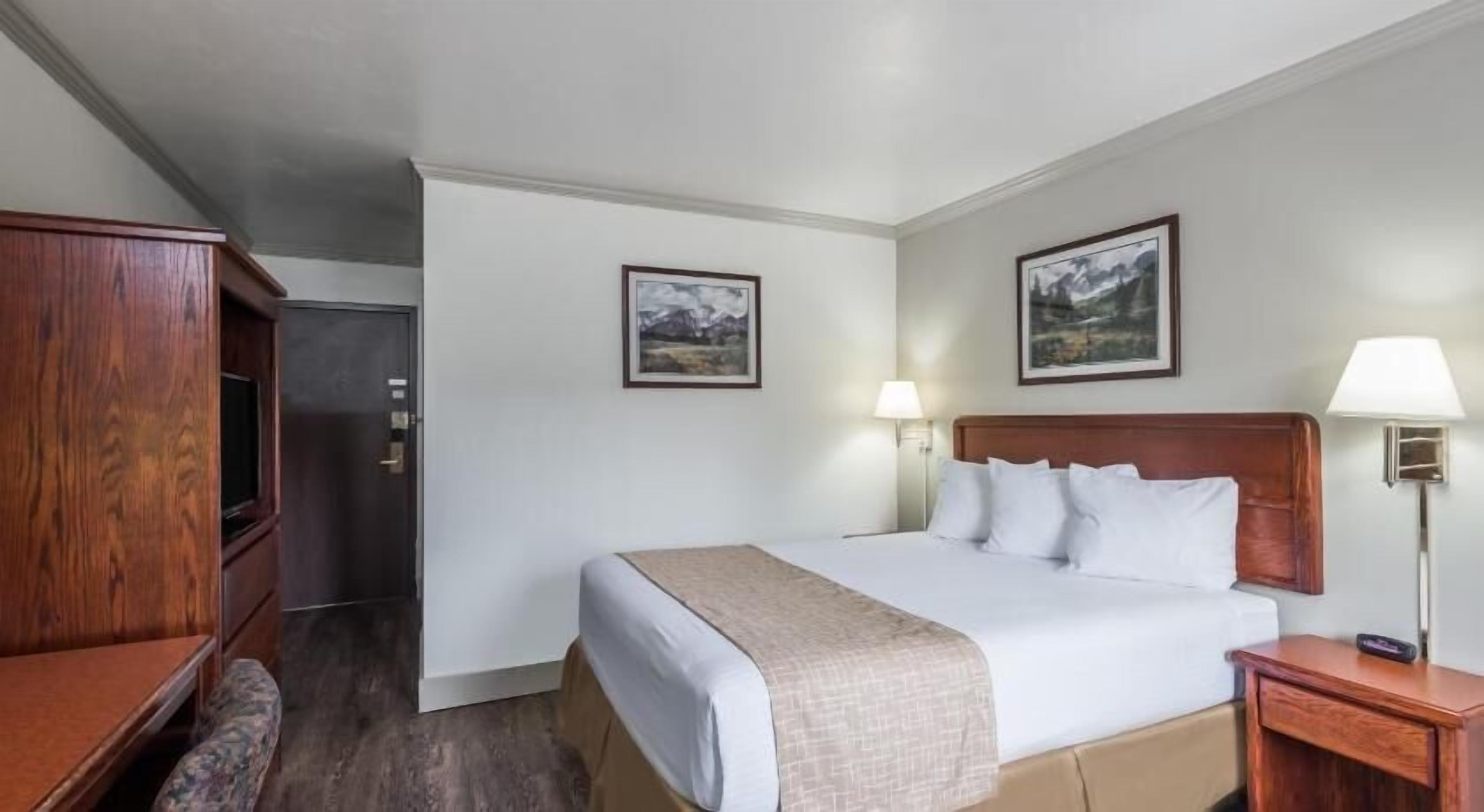 Desk, blackout drapes, iron/ironing board, rollaway beds