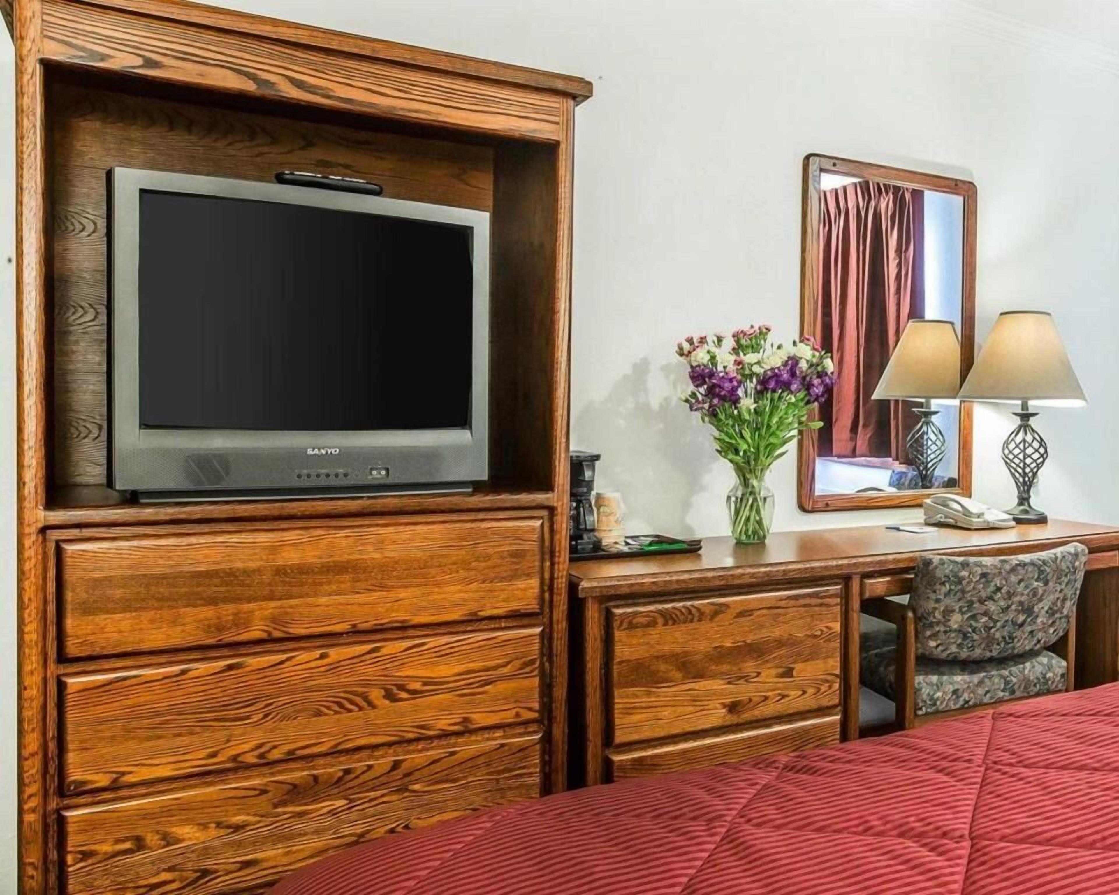 Desk, blackout drapes, iron/ironing board, rollaway beds