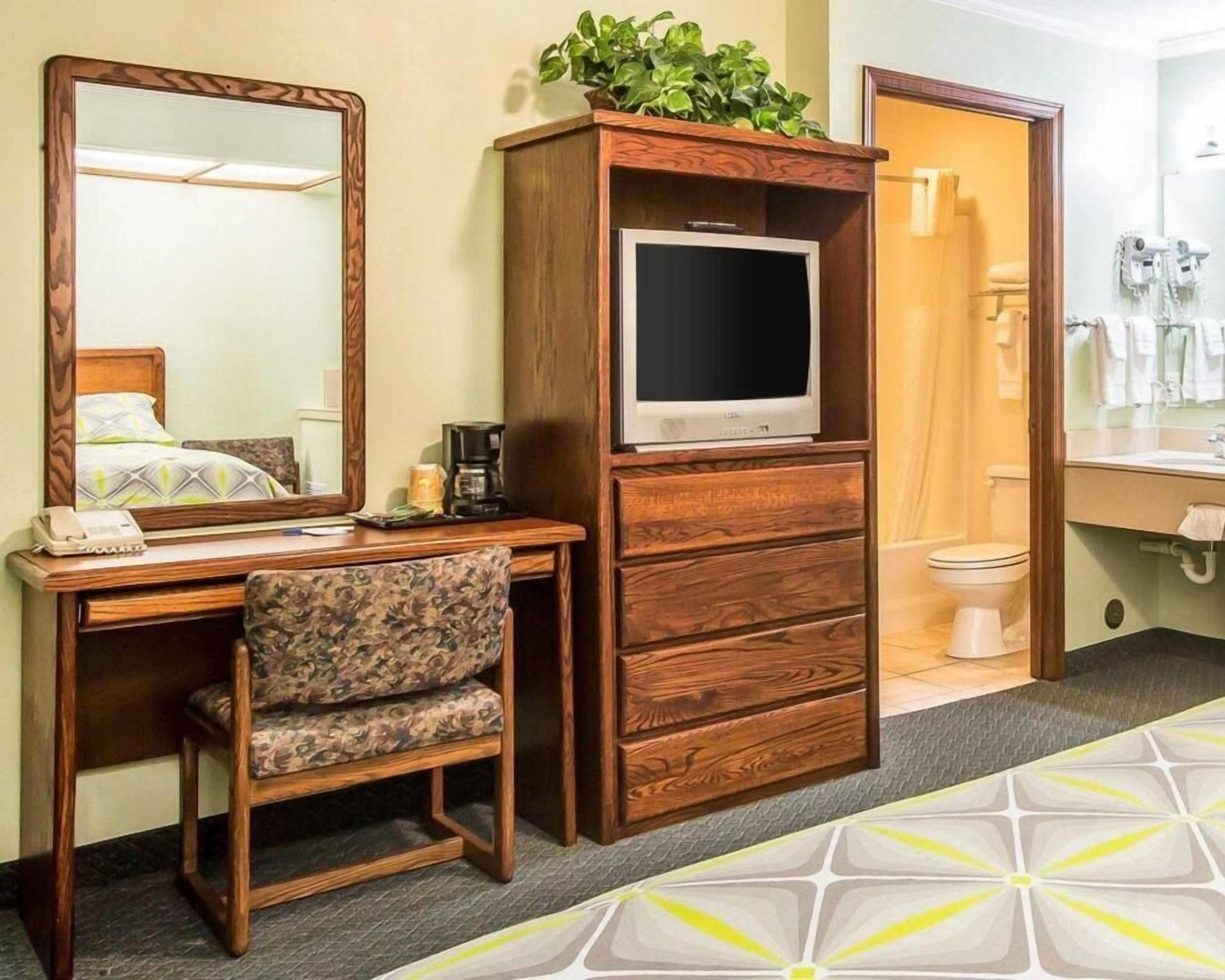 Desk, blackout drapes, iron/ironing board, rollaway beds