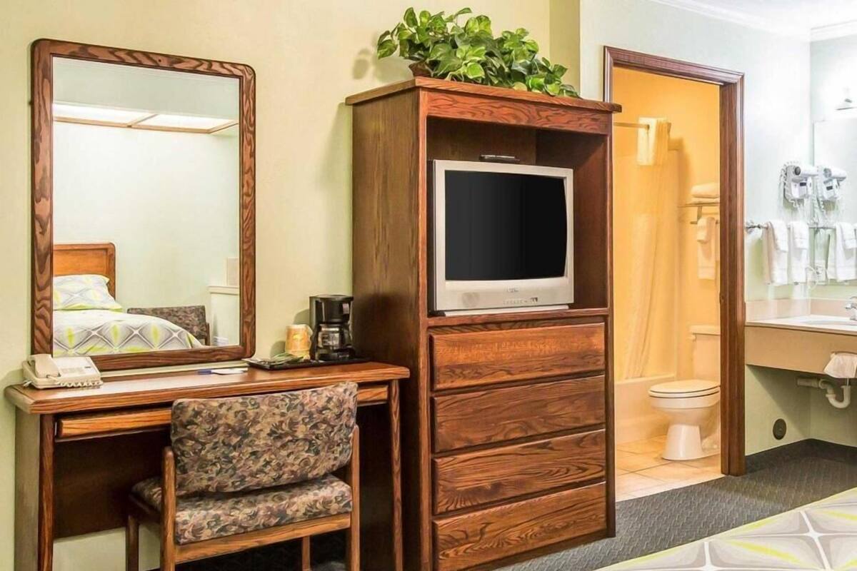 Desk, blackout drapes, iron/ironing board, rollaway beds