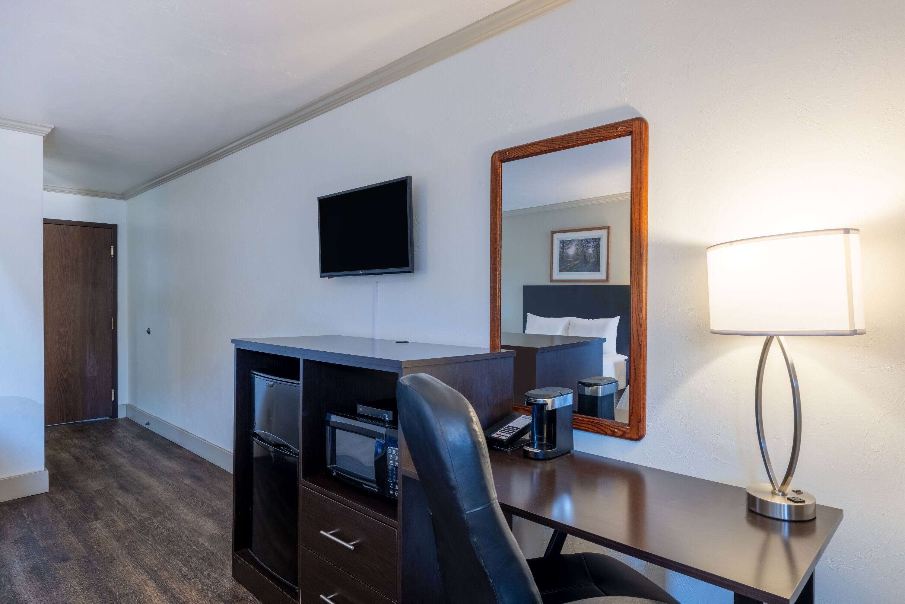 Desk, blackout drapes, iron/ironing board, rollaway beds