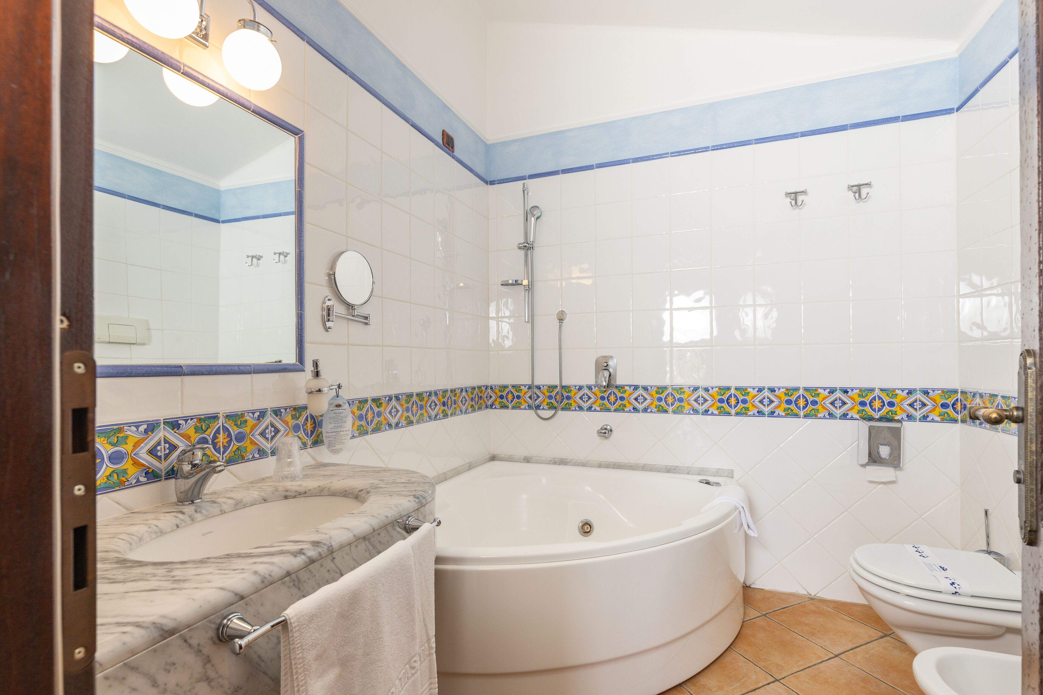 junior double room, jetted tub, tower | bathroom | jetted bath, rainfall showerhead, free toiletries, hair dryer