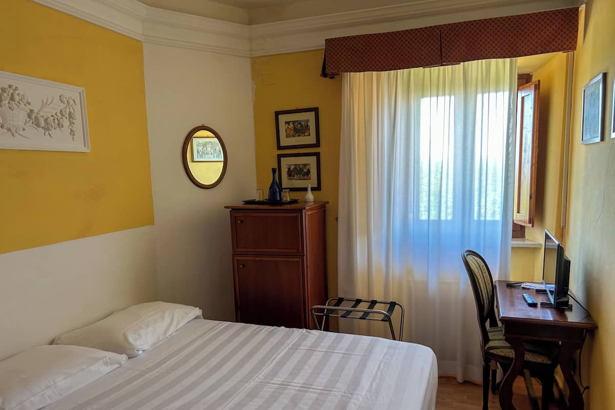Premium bedding, down duvets, in-room safe, desk