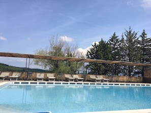 Seasonal outdoor pool, open 9:00 AM to 8 PM, pool umbrellas