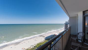Enjoy the serene ocean views from this balcony with a clear view of the beach.